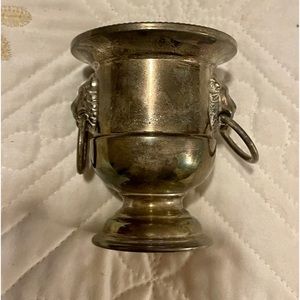 Tiny silver ice bucket. Used to hold small items like toothpicks.